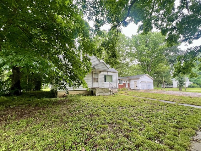103 W 2nd St, Broadlands, IL 61816 - obstructed view of property with driveway and a front yard