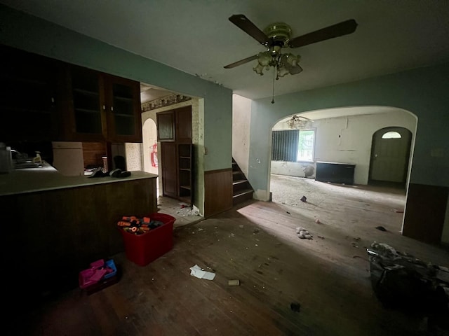 103 W 2nd St, Broadlands, IL 61816 - unfurnished living room featuring a ceiling fan, arched walkways, and stairway