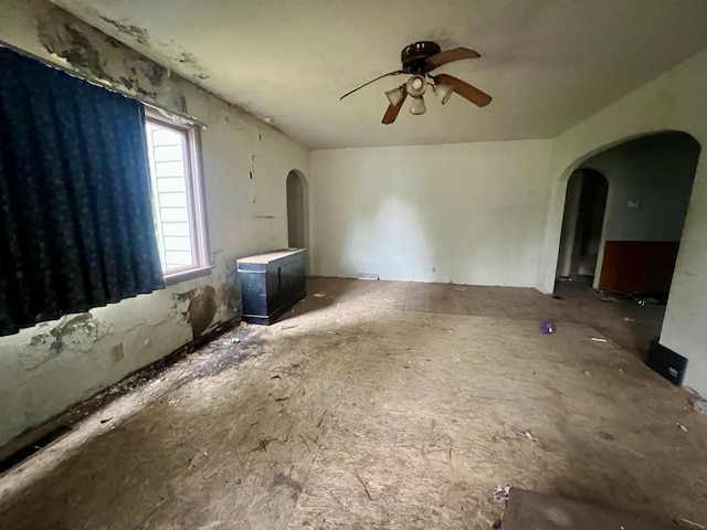 103 W 2nd St, Broadlands, IL 61816 - unfurnished living room with arched walkways and ceiling fan