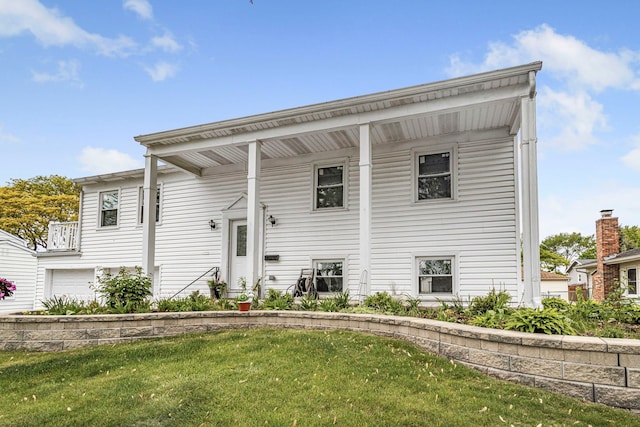 1810 Portsmouth Ln, Schaumburg, IL 60194 - back of house with a lawn and an attached garage