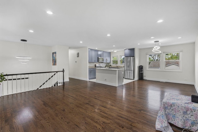 1810 Portsmouth Ln, Schaumburg, IL 60194 - living room featuring dark wood-style flooring, recessed lighting, and baseboards