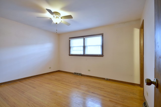 4732 N Anthon Ave, Chicago, IL 60656 - spare room featuring light wood-style flooring, a ceiling fan, and baseboards