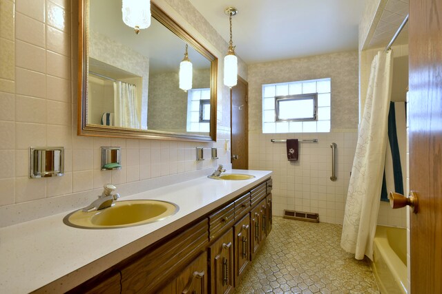 4732 N Anthon Ave, Chicago, IL 60656 - bathroom featuring tile walls, double vanity, and shower / bath combo with shower curtain