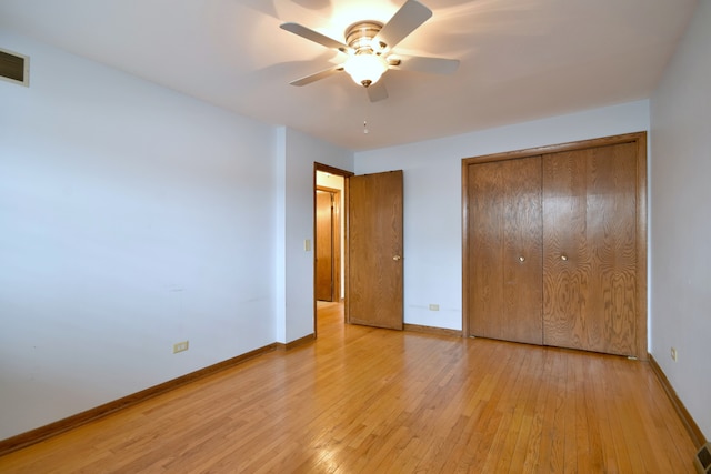 4732 N Anthon Ave, Chicago, IL 60656 - unfurnished bedroom featuring baseboards, light wood-style flooring, a closet, and ceiling fan