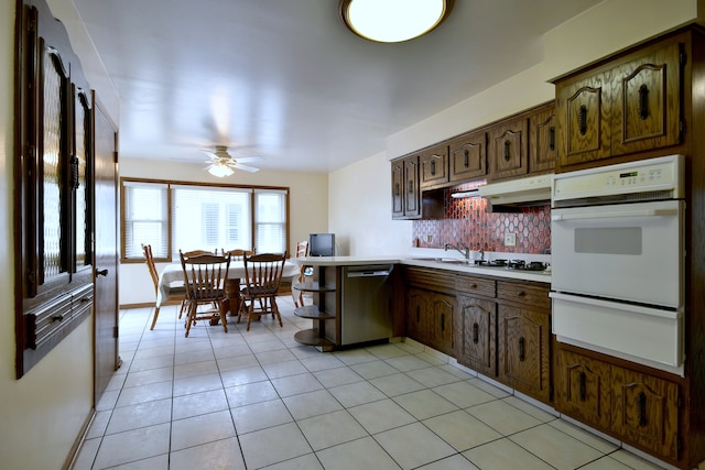 4732 N Anthon Ave, Chicago, IL 60656 - kitchen featuring white appliances, a warming drawer, tasteful backsplash, light countertops, and ceiling fan