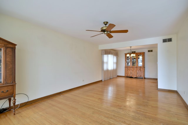 4732 N Anthon Ave, Chicago, IL 60656 - unfurnished living room with a chandelier, light wood-style floors, a ceiling fan, and baseboards