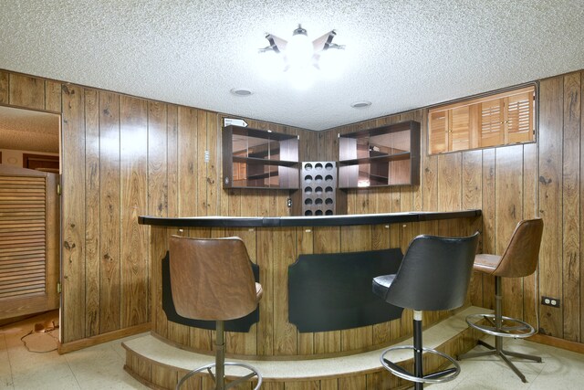 4732 N Anthon Ave, Chicago, IL 60656 - indoor dry bar with wood walls and a textured ceiling