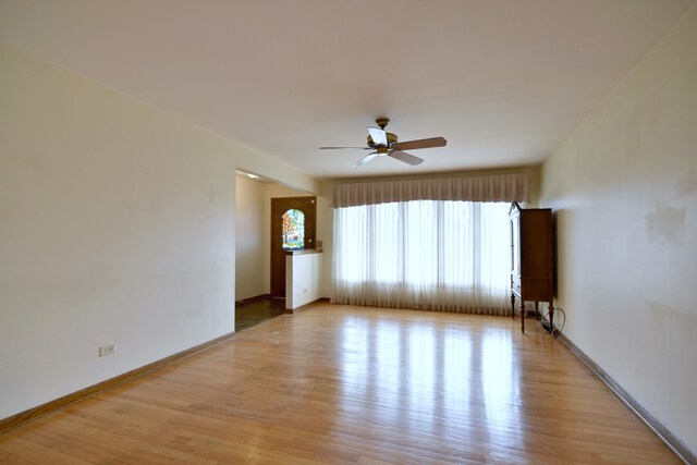4732 N Anthon Ave, Chicago, IL 60656 - empty room with light wood-style floors, a ceiling fan, and baseboards