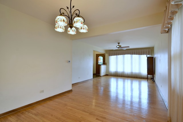 4732 N Anthon Ave, Chicago, IL 60656 - spare room featuring light wood-style floors, baseboards, a chandelier, and a ceiling fan