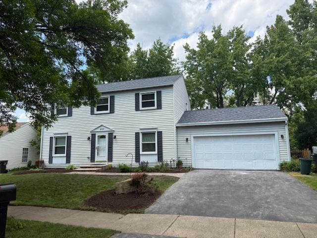 2030 University Dr, Naperville, IL 60565 - colonial inspired home with driveway, a garage, a front yard, and a shingled roof