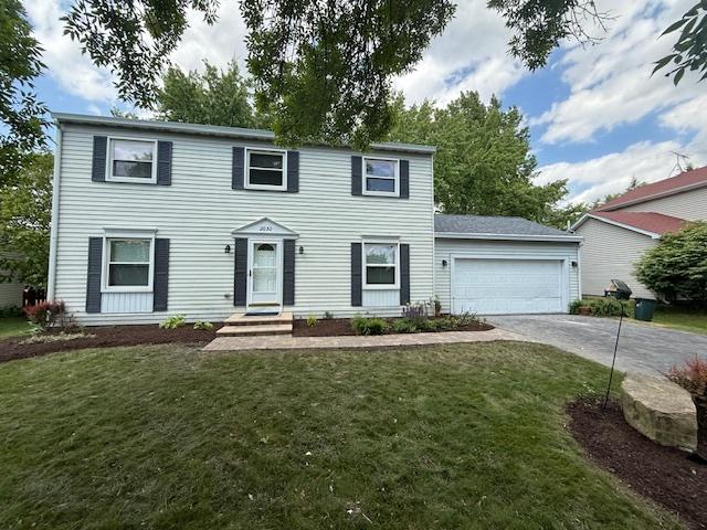 2030 University Dr, Naperville, IL 60565 - colonial inspired home with driveway, a garage, and a front yard