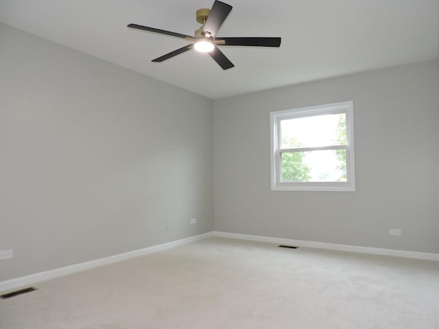 2030 University Dr, Naperville, IL 60565 - unfurnished room with light colored carpet, baseboards, and a ceiling fan