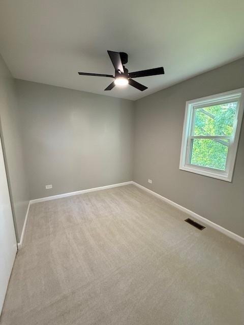 2030 University Dr, Naperville, IL 60565 - empty room with a ceiling fan, baseboards, and light carpet