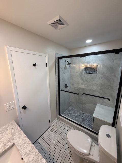2030 University Dr, Naperville, IL 60565 - bathroom with toilet, a shower stall, and recessed lighting