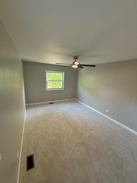 2030 University Dr, Naperville, IL 60565 - carpeted empty room with baseboards and a ceiling fan