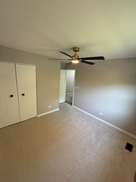 2030 University Dr, Naperville, IL 60565 - unfurnished bedroom featuring baseboards, light carpet, and a closet