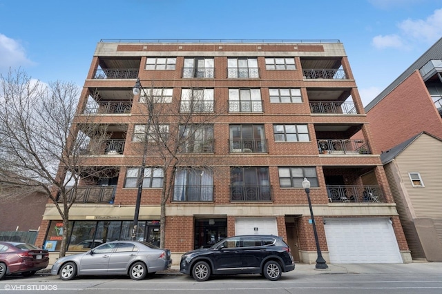 1618 S Halsted St Unit 4D, Chicago, IL 60608 - view of apartment building / complex featuring an attached garage