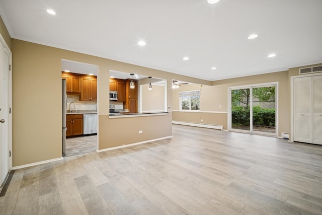 2443 E Brandenberry Ct Unit 1B, Arlington Heights, IL 60004 - unfurnished living room featuring a baseboard heating unit, light wood-style flooring, baseboards, recessed lighting, and a ceiling fan