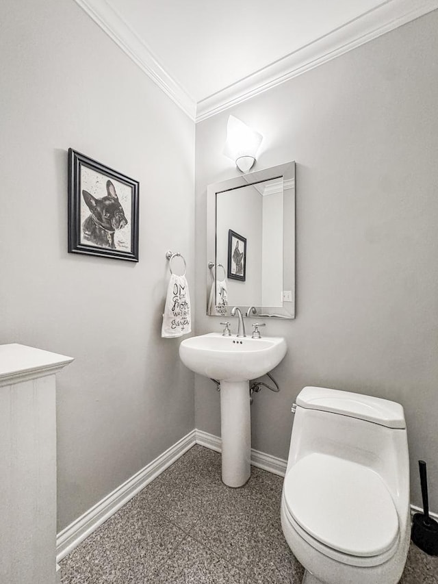 2736 N Hampden Ct Unit 105, Chicago, IL 60614 - bathroom with baseboards, ornamental molding, toilet, and speckled floor