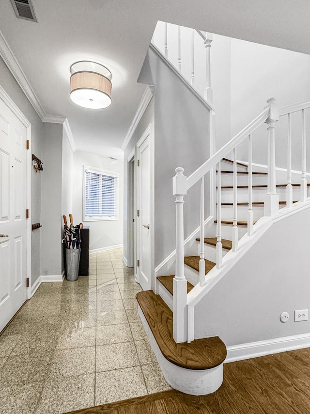 2736 N Hampden Ct Unit 105, Chicago, IL 60614 - entryway featuring ornamental molding, baseboards, stairs, and granite floors