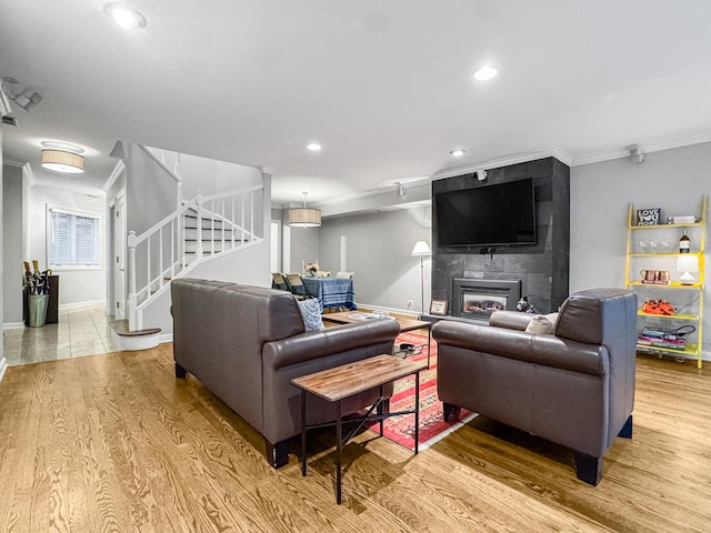 2736 N Hampden Ct Unit 105, Chicago, IL 60614 - living area featuring ornamental molding, stairway, wood finished floors, a fireplace, and recessed lighting