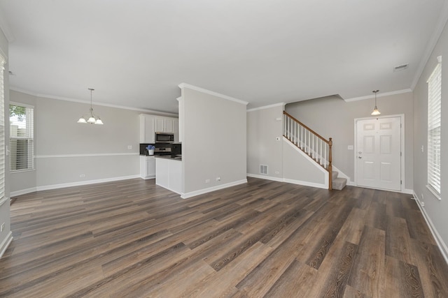 2911 Boone Ct, Joliet, IL 60435 - unfurnished living room featuring stairway, dark wood-style floors, baseboards, a chandelier, and ornamental molding