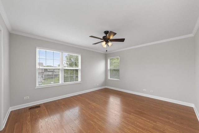 2911 Boone Ct, Joliet, IL 60435 - spare room featuring ornamental molding, baseboards, wood finished floors, and ceiling fan