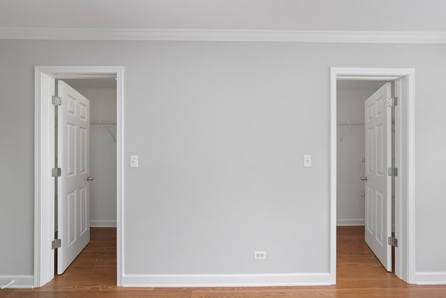 2911 Boone Ct, Joliet, IL 60435 - unfurnished bedroom with a spacious closet, a closet, ornamental molding, and baseboards