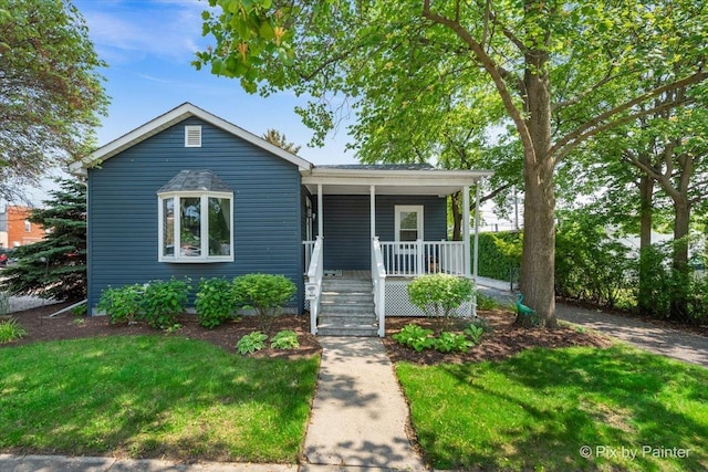 111 W N St, Plano, IL 60545 - view of front of property featuring covered porch and a front yard