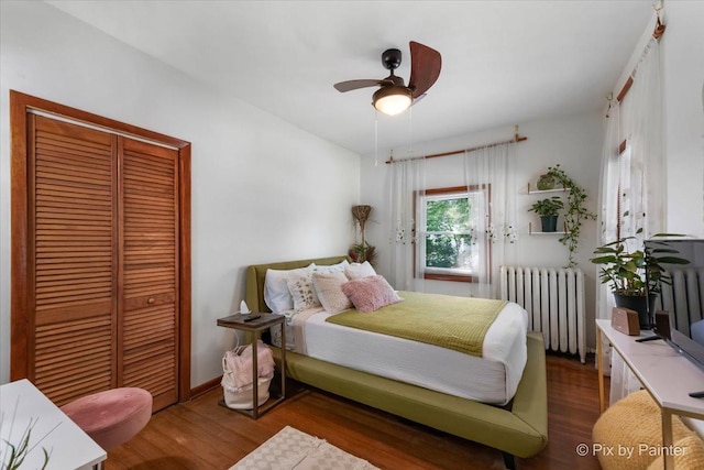 111 W N St, Plano, IL 60545 - bedroom featuring radiator, a closet, wood finished floors, and a ceiling fan