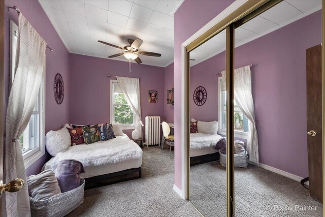 111 W N St, Plano, IL 60545 - carpeted bedroom featuring radiator, ceiling fan, and baseboards