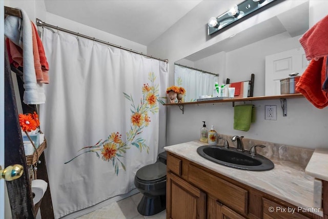 111 W N St, Plano, IL 60545 - bathroom with vanity, toilet, and tile patterned flooring