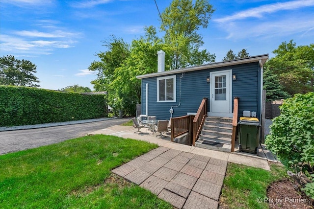 111 W N St, Plano, IL 60545 - back of property featuring a patio