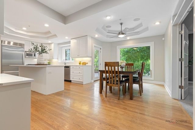 5272 Pineham Ct, Long Grove, IL 60047 - dining area with a raised ceiling, plenty of natural light, a ceiling fan, light wood-type flooring, and recessed lighting