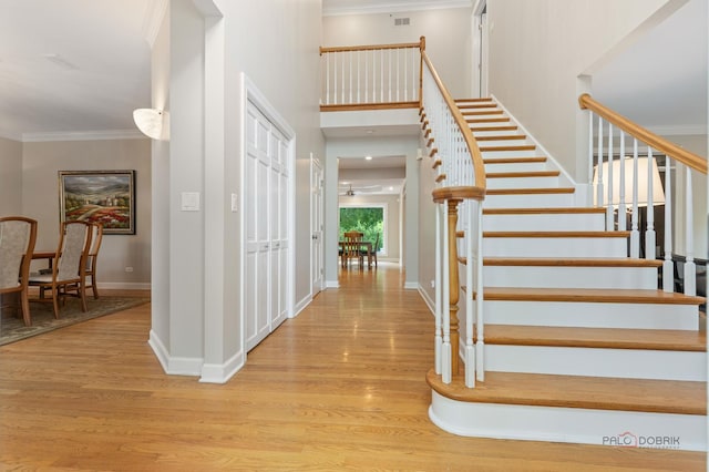 5272 Pineham Ct, Long Grove, IL 60047 - stairs featuring wood finished floors, ornamental molding, and baseboards