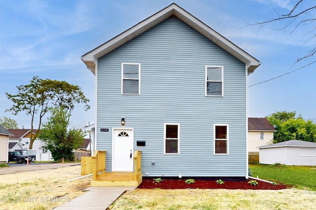 554 E Jackson St, Joliet, IL 60432 - rear view of property featuring a lawn