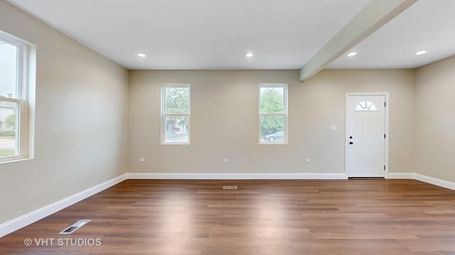 554 E Jackson St, Joliet, IL 60432 - unfurnished room with baseboards, wood finished floors, recessed lighting, and beam ceiling