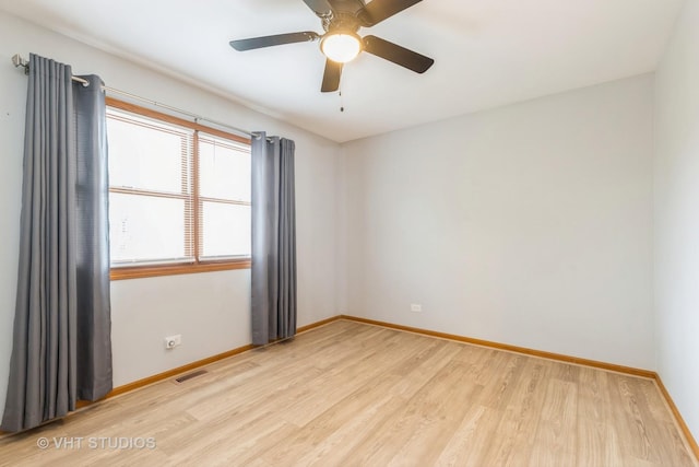 419 N Cresthill Ave, Mchenry, IL 60050 - spare room featuring wood finished floors, baseboards, and a ceiling fan