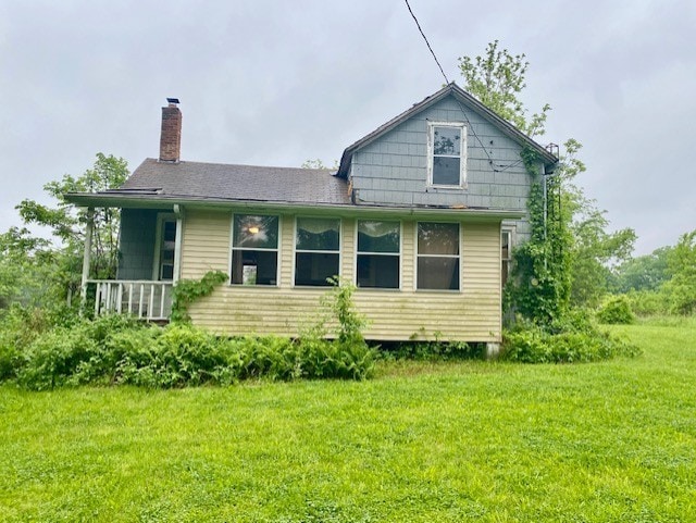 27844 1260 N Ave, Princeton, IL 61356 - back of house featuring a chimney and a lawn