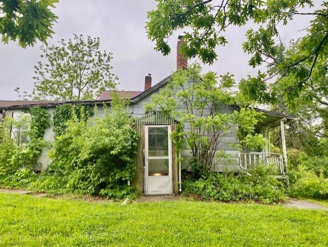 27844 1260 N Ave, Princeton, IL 61356 - back of house with a chimney and a lawn