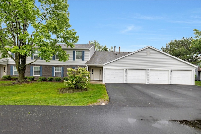 690 Thorntree Ct Unit C1, Bartlett, IL 60103 - colonial inspired home with a garage, driveway, a front yard, and a shingled roof