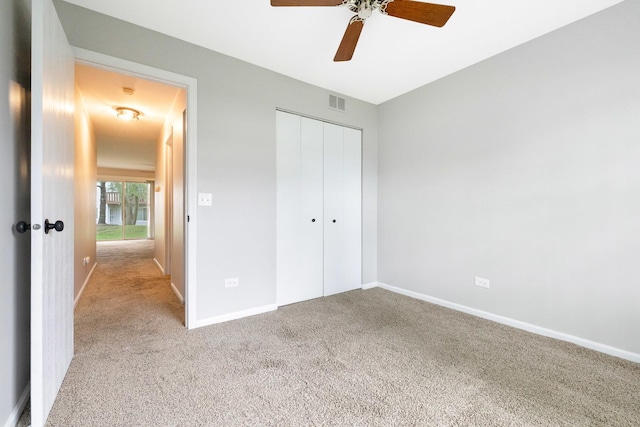 690 Thorntree Ct Unit C1, Bartlett, IL 60103 - unfurnished bedroom featuring carpet floors, a closet, baseboards, and a ceiling fan