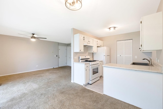 690 Thorntree Ct Unit C1, Bartlett, IL 60103 - kitchen featuring white appliances, a sink, light carpet, under cabinet range hood, and white cabinetry