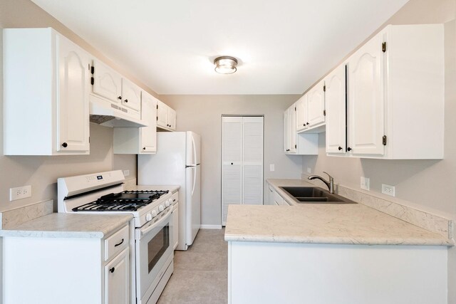 690 Thorntree Ct Unit C1, Bartlett, IL 60103 - kitchen with white appliances, a sink, under cabinet range hood, white cabinetry, and light countertops