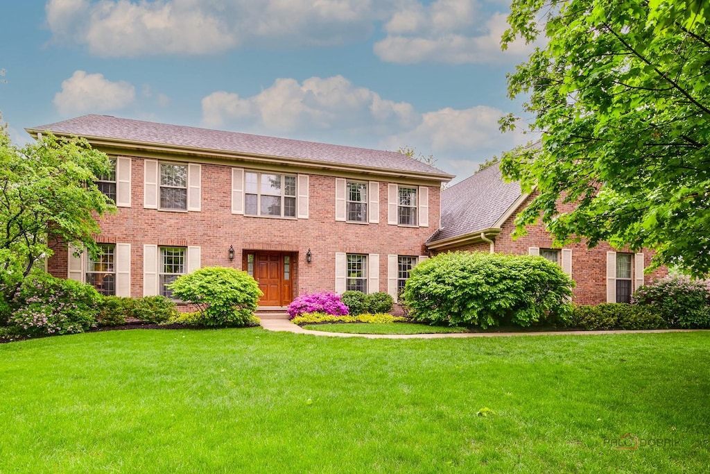 2872 Whispering Oaks Ct, Buffalo Grove, IL 60089 - colonial-style house with brick siding and a front yard
