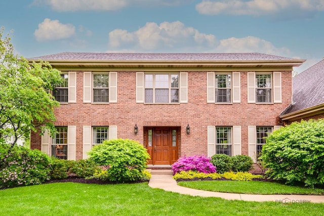 2872 Whispering Oaks Ct, Buffalo Grove, IL 60089 - colonial inspired home featuring brick siding and a front lawn