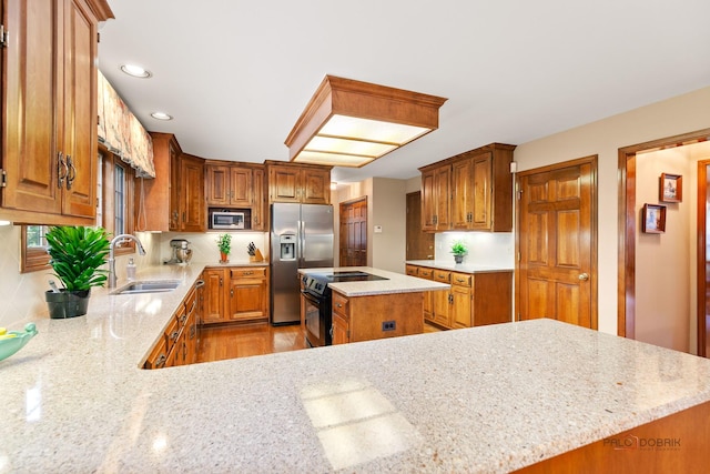2872 Whispering Oaks Ct, Buffalo Grove, IL 60089 - kitchen with a sink, stainless steel appliances, light stone countertops, a center island, and recessed lighting