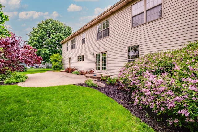 2872 Whispering Oaks Ct, Buffalo Grove, IL 60089 - rear view of property with a yard and a patio area