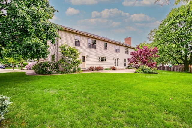 2872 Whispering Oaks Ct, Buffalo Grove, IL 60089 - back of house with a chimney and a patio