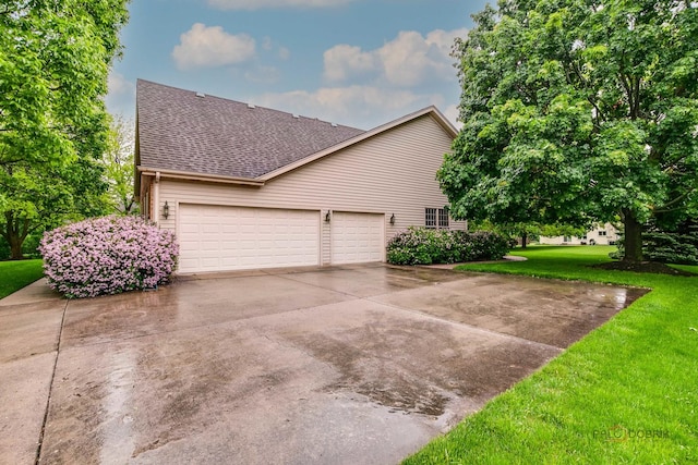 2872 Whispering Oaks Ct, Buffalo Grove, IL 60089 - view of side of home with a shingled roof, a lawn, driveway, and a garage